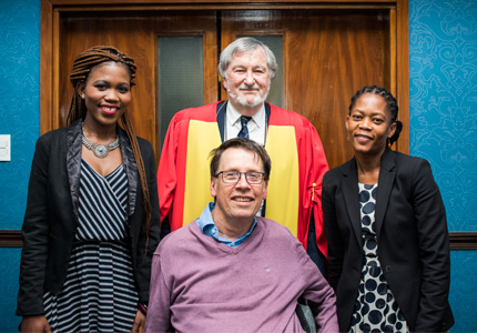 Prof. Eddie Webster flanked by former students.Top row (l-r): Nonkululeko Mabaso (masters student) and Dr Sarah Mosoetsa (Director: National Institute for the Humanities and Social Sciences) and Dr Karl von Holdt (Director: SWOP) 