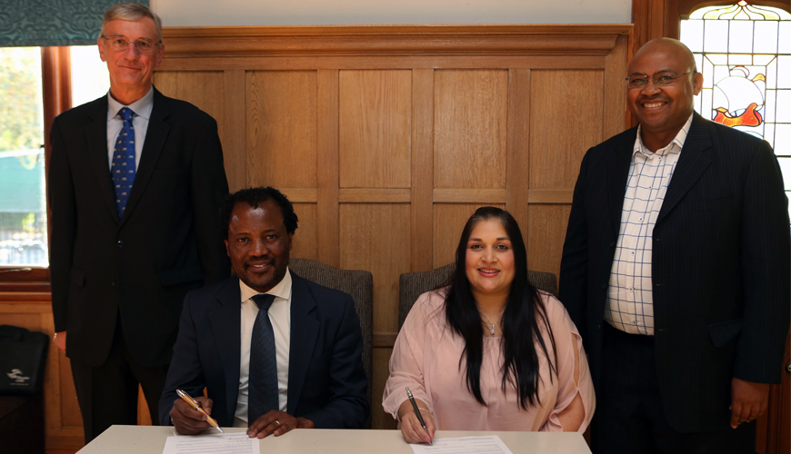 Professor Zeblon Vilakazi, Deputy Vice Chancellor at Wits University, sits together with Raakshani Sing, Executive Manager at CHIETA during the signing ceremony of Africa’s first Energy Leadership Centre (ELC), officially launched at the Wits Business School. They are flanked by Dr Rod Crompton, newly-appointed Director of the ELC (on the left) and Maurice Radebe, Deputy Vice President: Energy and