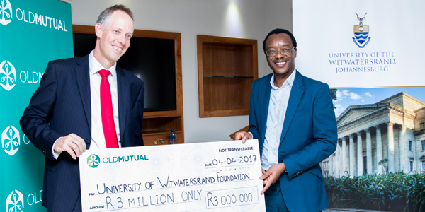 Iain Williamson, Finance Director and Interim CEO of Old Mutual Emerging Markets, handed over the cheque to Professor Tawana Kupe, Deputy Vice-Chancellor: Advancement, Human Resources and Transformation