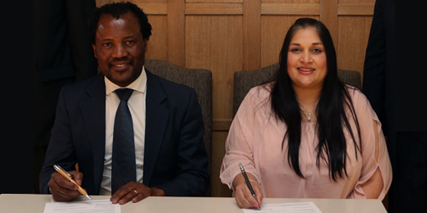 Professor Zeblon Vilakazi, Deputy Vice Chancellor at Wits University, sits together with Raakshani Sing, Executive Manager at CHIETA during the signing ceremony of Africa’s first Energy Leadership Centre (ELC).