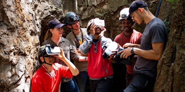 The exploration team of the Rising Star expedition experiences the Dinaledi VR for the first time.