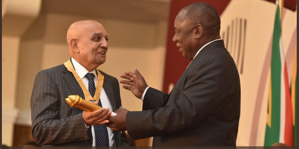  President Cyril Ramaphosa bestowing a National Order on Professor Yosuf Veriava ( Photo credit: @PresidencyZA)