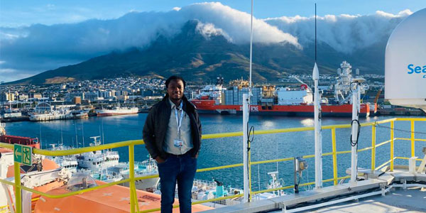 Dr Mbili Tshiningayamwe on the deck of the Joides Resolution in Cape Town harbour.