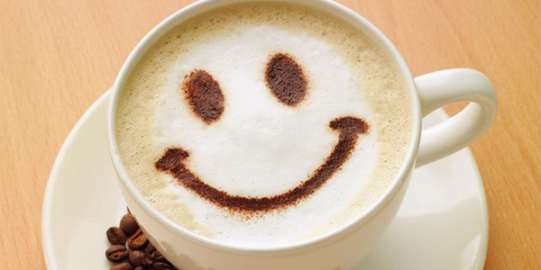 Cup of coffee with smiley face