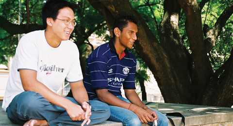 Students sitting on ledge Wits Campus