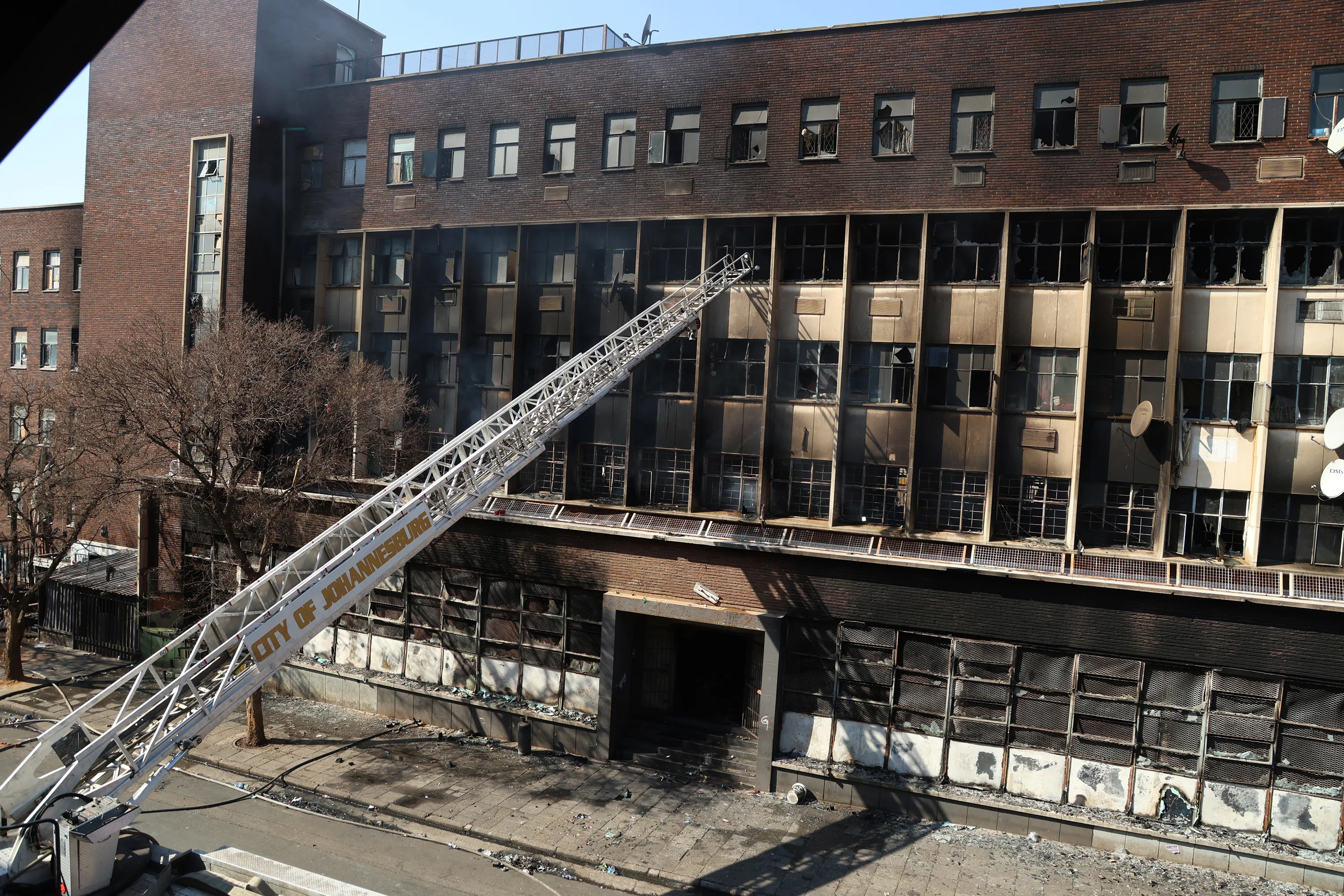 The smouldering five-storey Johannesburg CBD building on the corner of Alberts and Delvers street (Photo: Felix Dlangamandla)