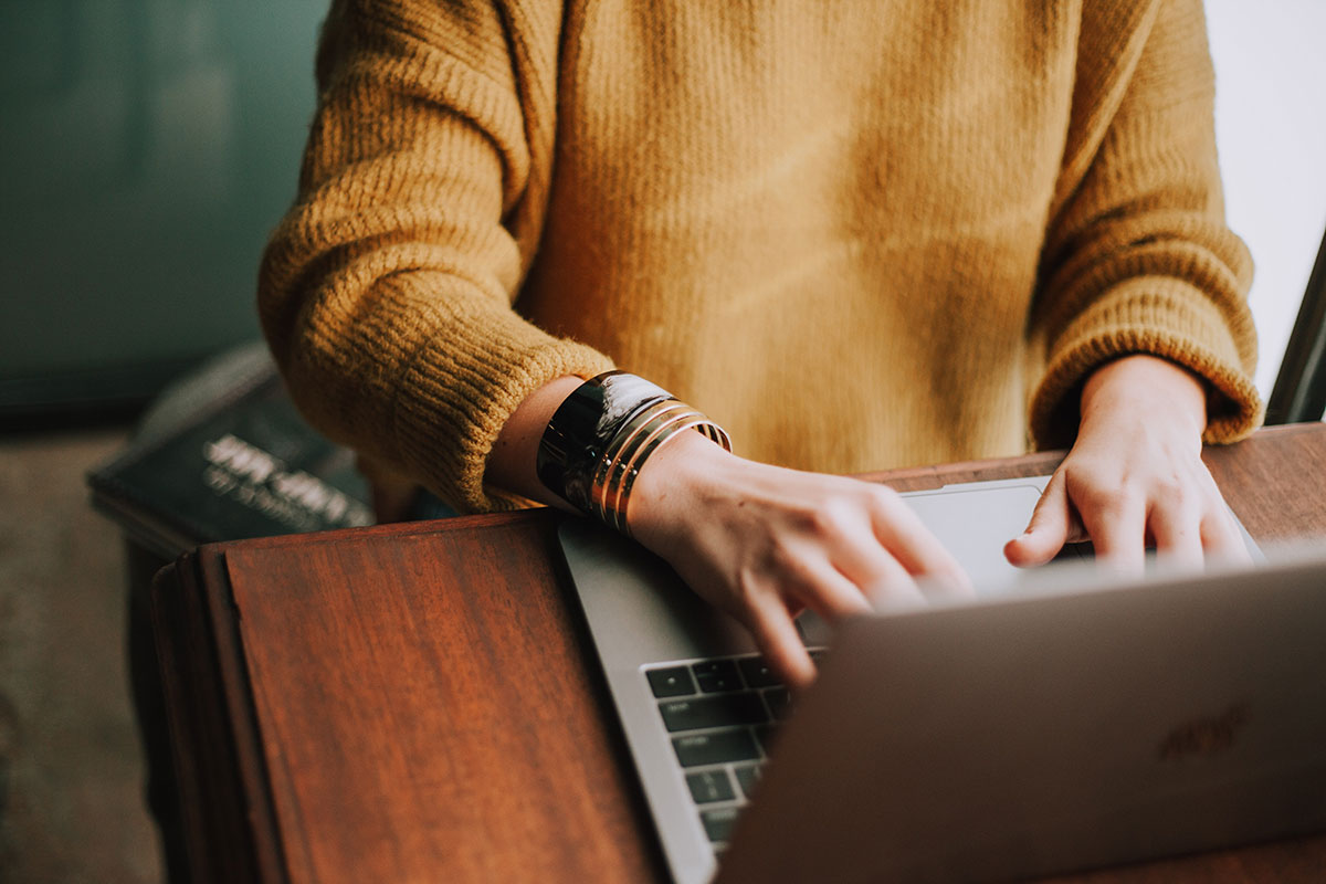 Hands on laptop Photo Christin Hume on Unsplash