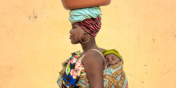 Woman with baby on her back