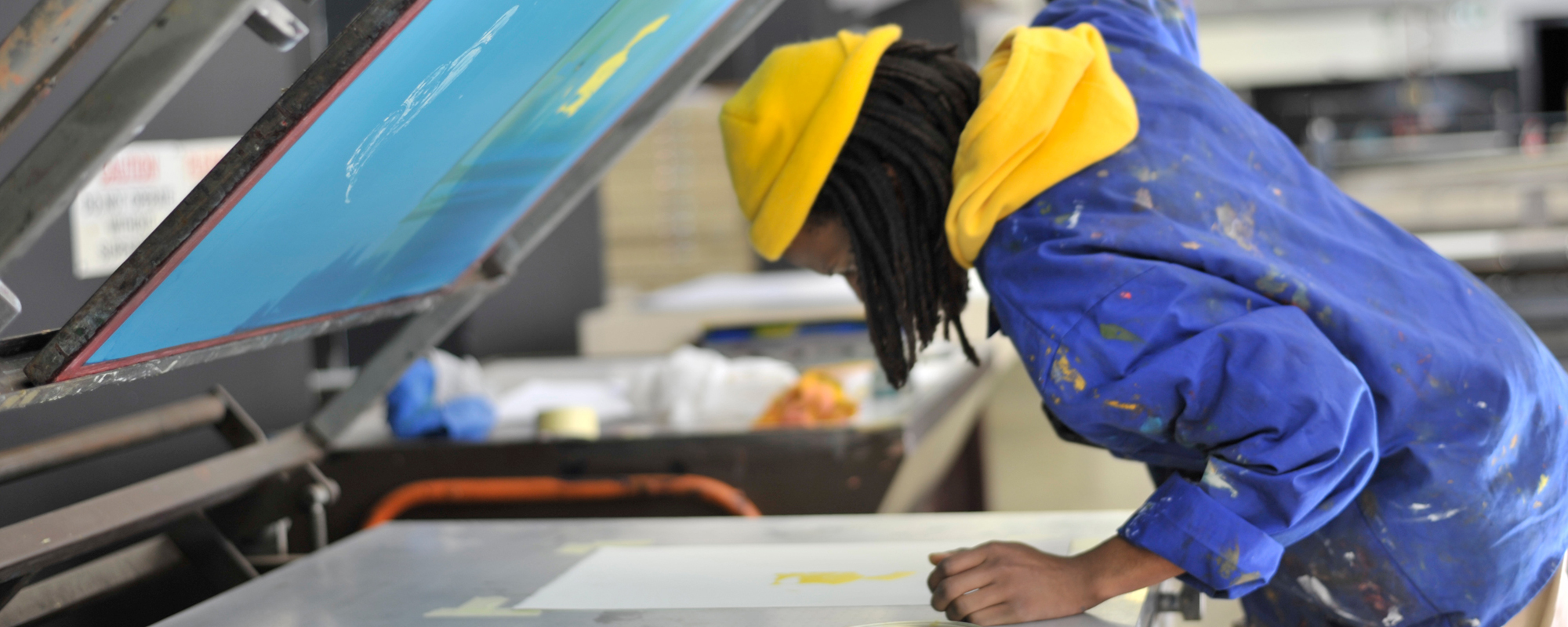 fine arts student working in the print studio