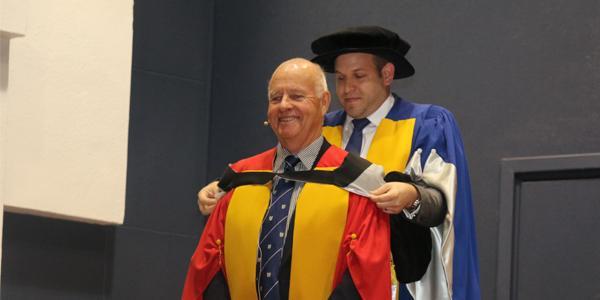Wits alumnus Prof. John Gear receives an honorary degree at the Faculty of Health Sciences graduation in December 2017 for pioneering community health at Wits