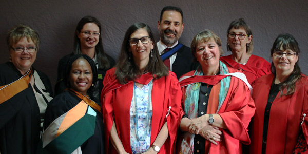  (Front from left) Janet Zambri, Thuli Dhlamini, Professor Karin Brodie (Head of the Wits School of Education), DrLaura Dison (PGDiPE(HE) Co-coordinator) and Jacqueline De Matos Ala. (Back from left)Agata Macgregor, David Merand and Estelle Trengove.