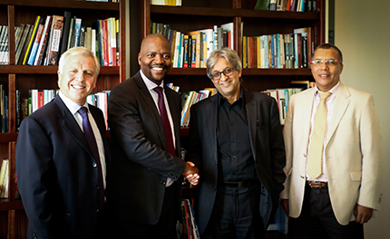 Absa Bank’s Dr Theunie Lategan and Mr Steven Seaka hand over a letter confirming Absa’s R10 million donation to Wits’ Professor Adam Habib and Dr Randall Carolissen.