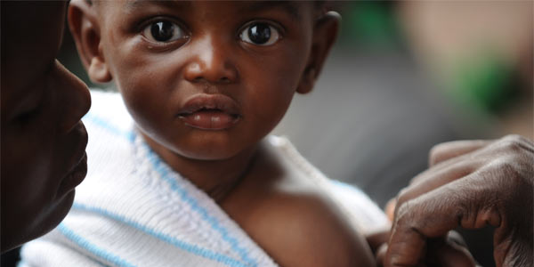 Child being vaccinated.