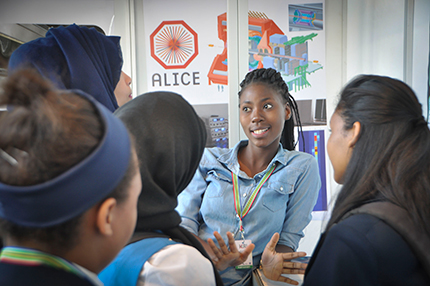 Physics student Joyful Mdhluli speaking with learners at ICRI 2016.