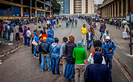 People queuing for food.