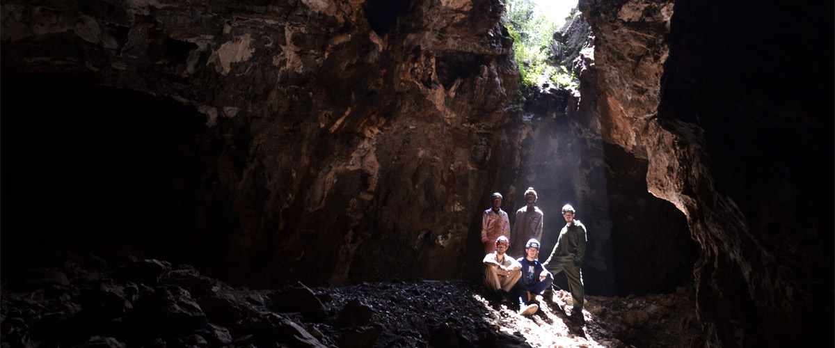 Standing left to right: Mathabela Tsikoane, Maropeng Ramalepa, Dirk van Rooyen, Steven Tucker (seated), and Rick Hunter (seated) inside the Rising Star cave system. ©Wits University/Marina Elliott