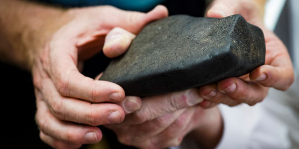 Close-up of the meteorite fragment showing the fusion crust. Credit: Wits University