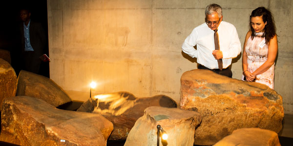 Guests enjoy a part of the exhibition at the opening of the rock art archive in the new wing of the Origins Centre at Wits University. Credit: Wits University