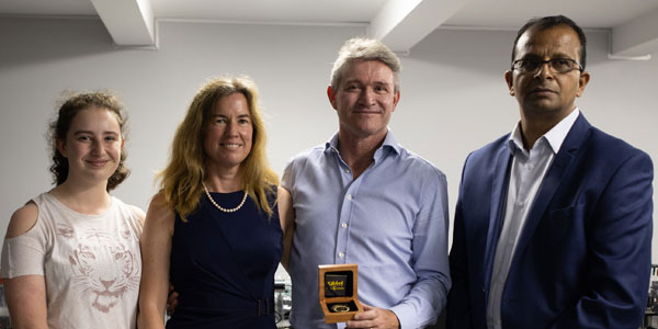 Professor Andrew Forbes and his family with Professor Deena Naidoo