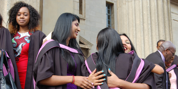 Students celebrate graduating Students celebrate graduating