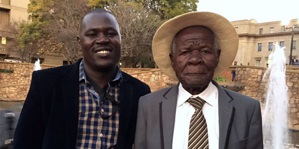 Dr Francis Otieno and his father, Mzee Christopher Otieno Oluoch, at Francis Otieno’s PhD graduation in 2018 at the University of the Witwatersrand, South Africa. ©Francis Otieno