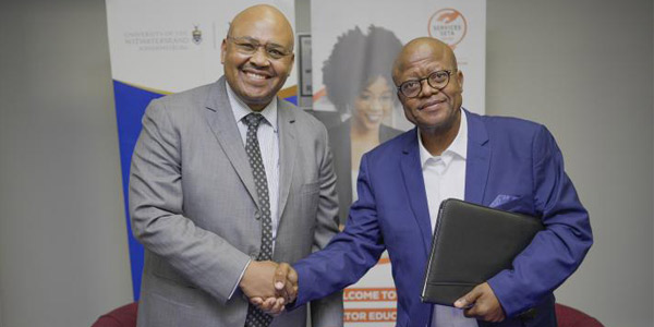 Professor Maurice Radebe and Andile Sipengane at a special signing ceremony for the Wits Business School and the Services SETA Professor Maurice Radebe and Andile Sipengane at a special signing ceremony for the Wits Business School and the Services SETA