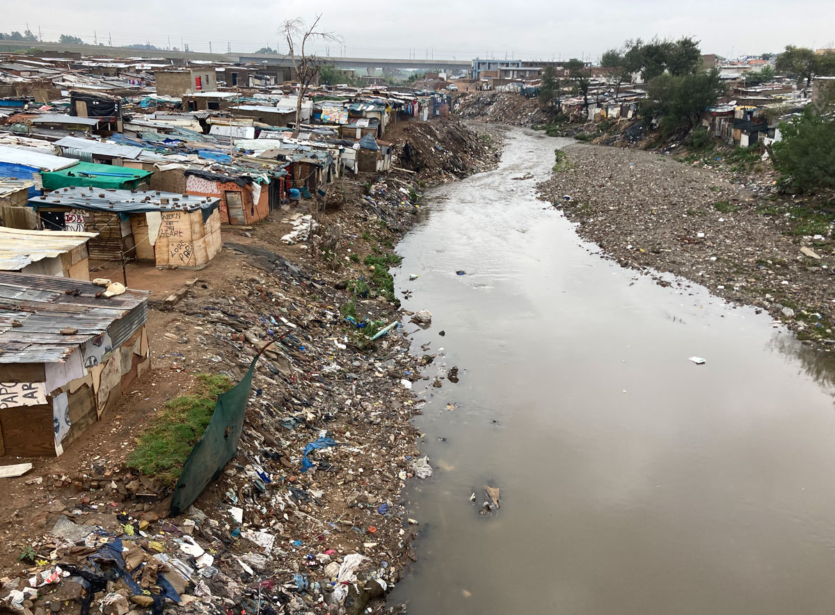 Rubbish along river in Alex