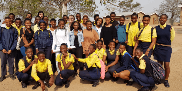 school learners under tree