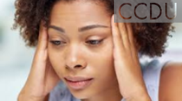 Woman holding side of her head with her hands