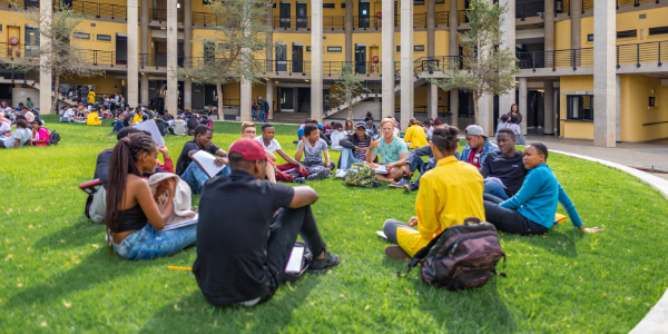 Students sitting outside at Science Stadium_image credit Shivan Parusnath