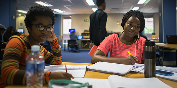 Two students in the library at Wits
