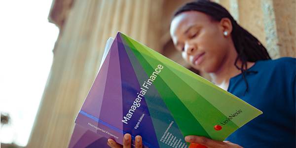 Wits student with course book